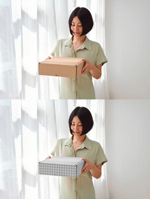 Mockup of Asian woman holding customizable gift box 646709822