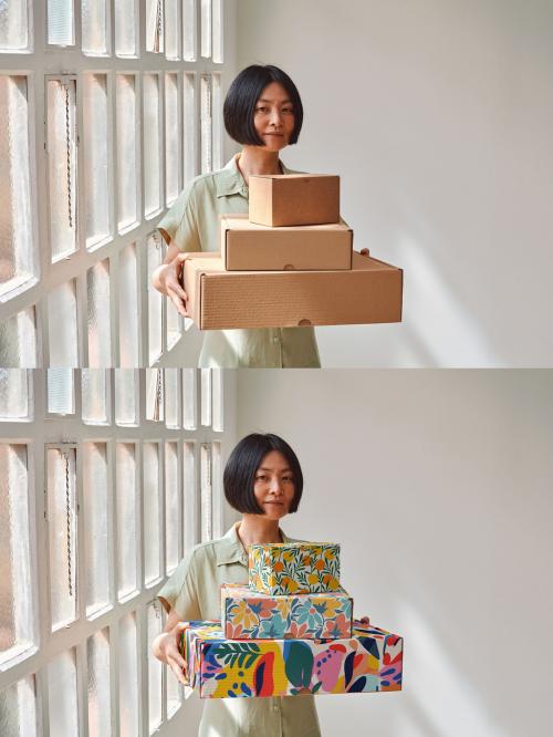 Mockup of Asian woman holding customizable cardboard gift boxes 646709631