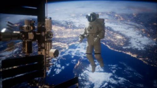 Videohive - International Space Station and Astronaut in Outer Space Over the Planet Earth - 48098241