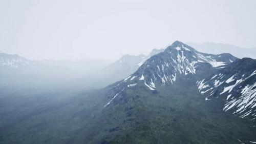 Videohive - Awesome Top View Through Clouds to High Snowy Mountains - 48099738
