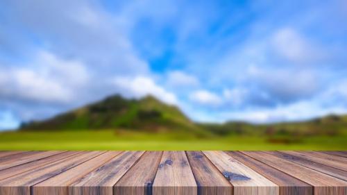 Premium PSD | Wooden table for display products with mountain view Premium PSD