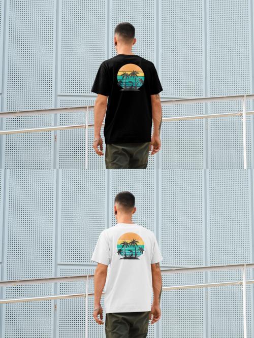 Mockup of man wearing t-shirt with customizable color standing by building, rear view 644104845