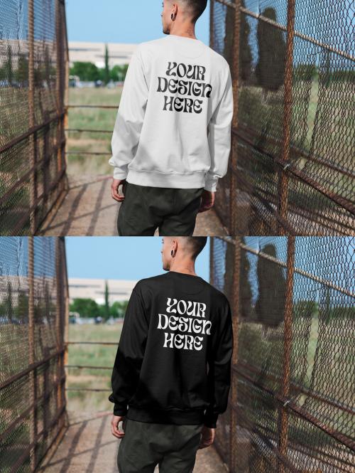 Mockup of man wearing sweatshirt with customizable color in urban setting, rear view 644104450