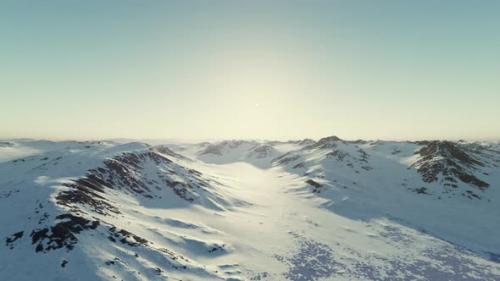 Videohive - A Majestic Snowy Mountain Range Illuminated By the Sun - 48389023