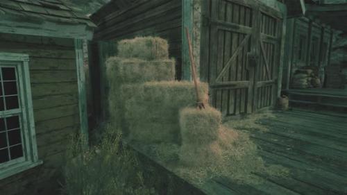 Videohive - A Rustic Barn with Hay Bales in the Foreground - 48386794