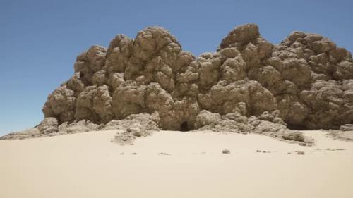 Videohive - A Large Rock Formation in the Middle of a Desert - 48387774