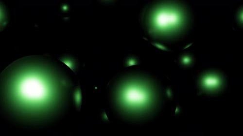 Videohive - Green glowing balls flying on a black background - 48310220