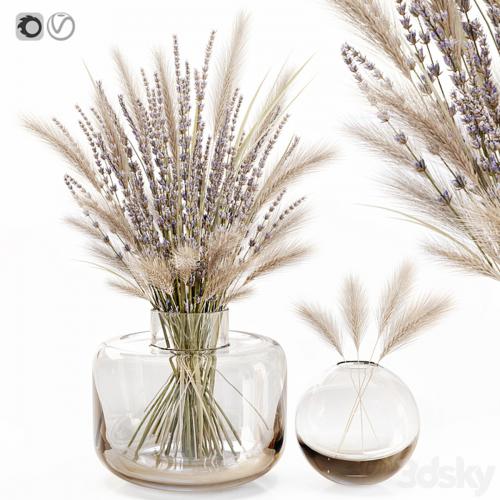 Dry flowers in glass vase with lavender