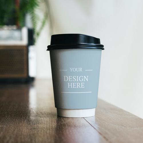 Adobe Stock - Paper Coffee Cup on Table Mockup - 249379969