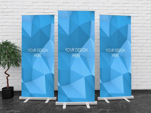 Adobe Stock - 3 Roll Up Banners Mockups Composition with White Brick Wall - 328371162