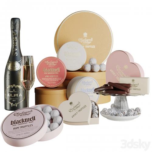 Gift set with sweets and desserts and a glass of wine