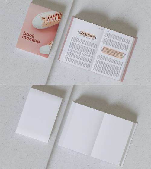 Adobe Stock - Open and Closed Book on Concrete Mockup - 392325170