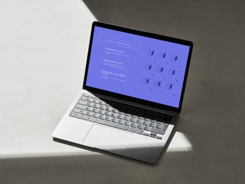 Adobe Stock - Laptop with Hard Shadow Lines on a Concrete Surface - 478873556