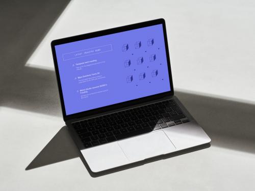 Adobe Stock - Laptop on a Concrete Floor with Hard Shadows - 478873566
