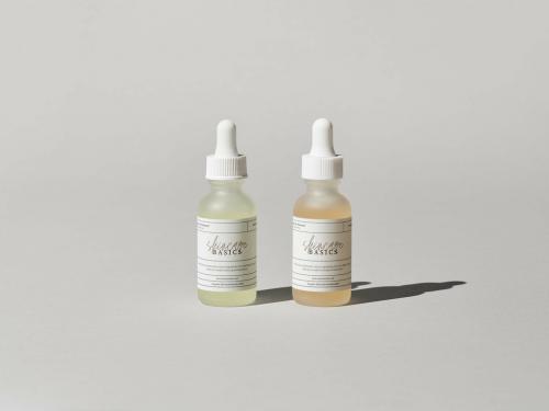 Two Bottles of Beauty Product Mockup with Label
