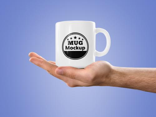 Mug in a Hand Mockup
